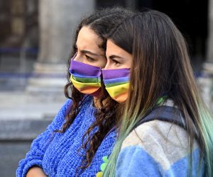 epa08753493 Protesters with LGBT pride face masks march during the demonstration at the Pantheon against homotransphobia and misogyny to ask that the Zan bill, against discrimination on grounds of sexual orientation, be approved as soon as possible, in Rome, Italy, 17 October 2020.  EPA/RICCARDO ANTIMIANI
