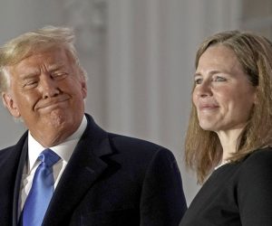 epa08776633 United States President Donald J. Trump (L) and Justice Amy Coney Barrett (R) pose for a photo on the Blue Room Balcony of the White House in Washington, DC, USA, 26 October 2020.  EPA/Ken Cedeno / POOL
