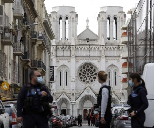 epa08782706 French police officers secure the street near the entrance of the Notre Dame Basilica church in Nice, France, 29 October 2020, following a knife attack. According to recent reports, at least three people are reported to have died in what officials treat as a terror attack. The attack comes less than a month after the beheading of a French middle school teacher in Paris on 16 October.  EPA/SEBASTIEN NOGIER