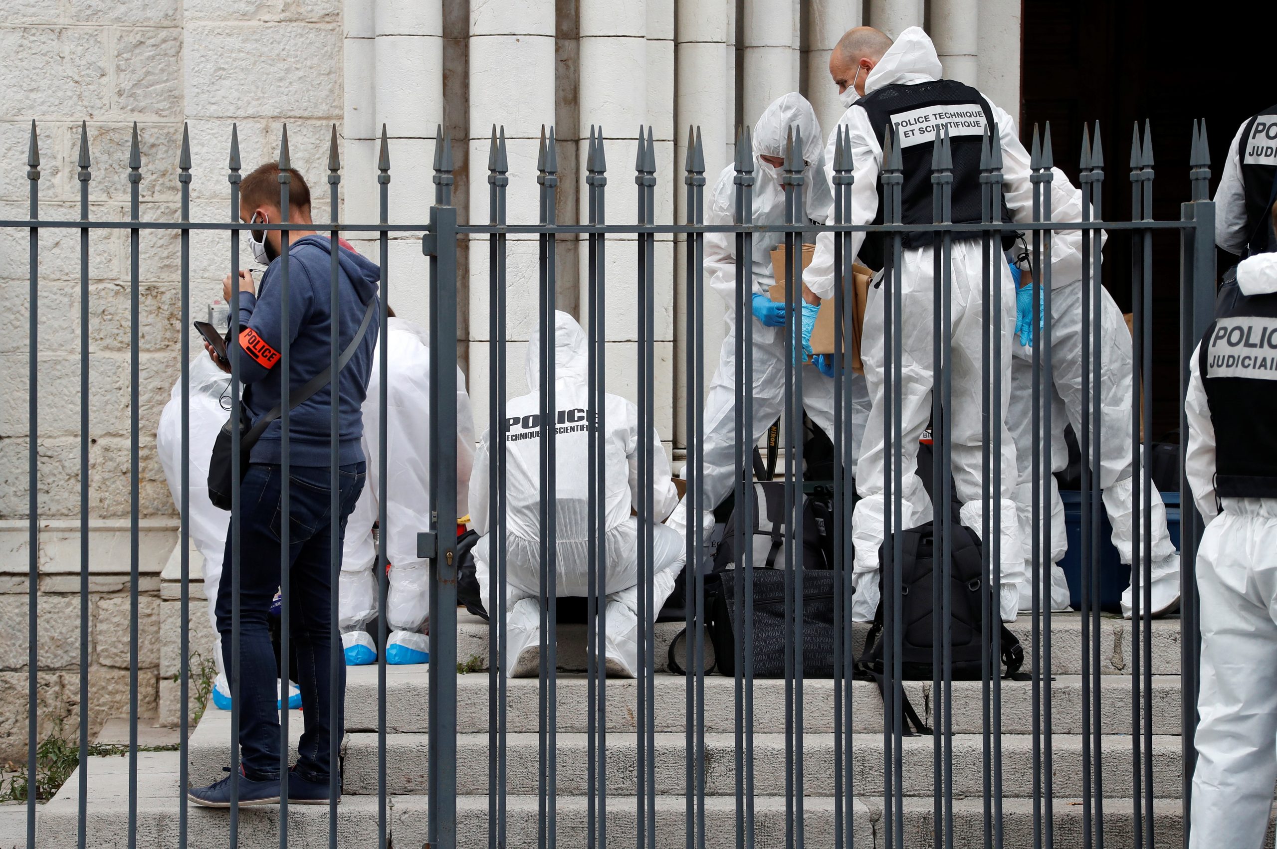 epa08782903 Forensic specialists inspect the scene of a reported knife attack at Notre Dame church in Nice, France, 29 October 2020. According to recent reports, at least three people are reported to have died in what officials treat as a terror attack. The attack comes less than a month after the beheading of a French middle school teacher in Paris on 16 October.  EPA/ERIC GAILLARD / POOL  MAXPPP OUT