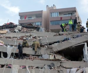 epa08786511 Rescue workers and people search for survivors at a collapsed building after a 7.0 magnitude earthquake in the Aegean Sea in Izmir, Turkey, 30 October 2020. According to Turkish media reports, at least six people died while hundreds were injured and dozens of buildings were destroyed in the earthquake.  EPA/STRINGER