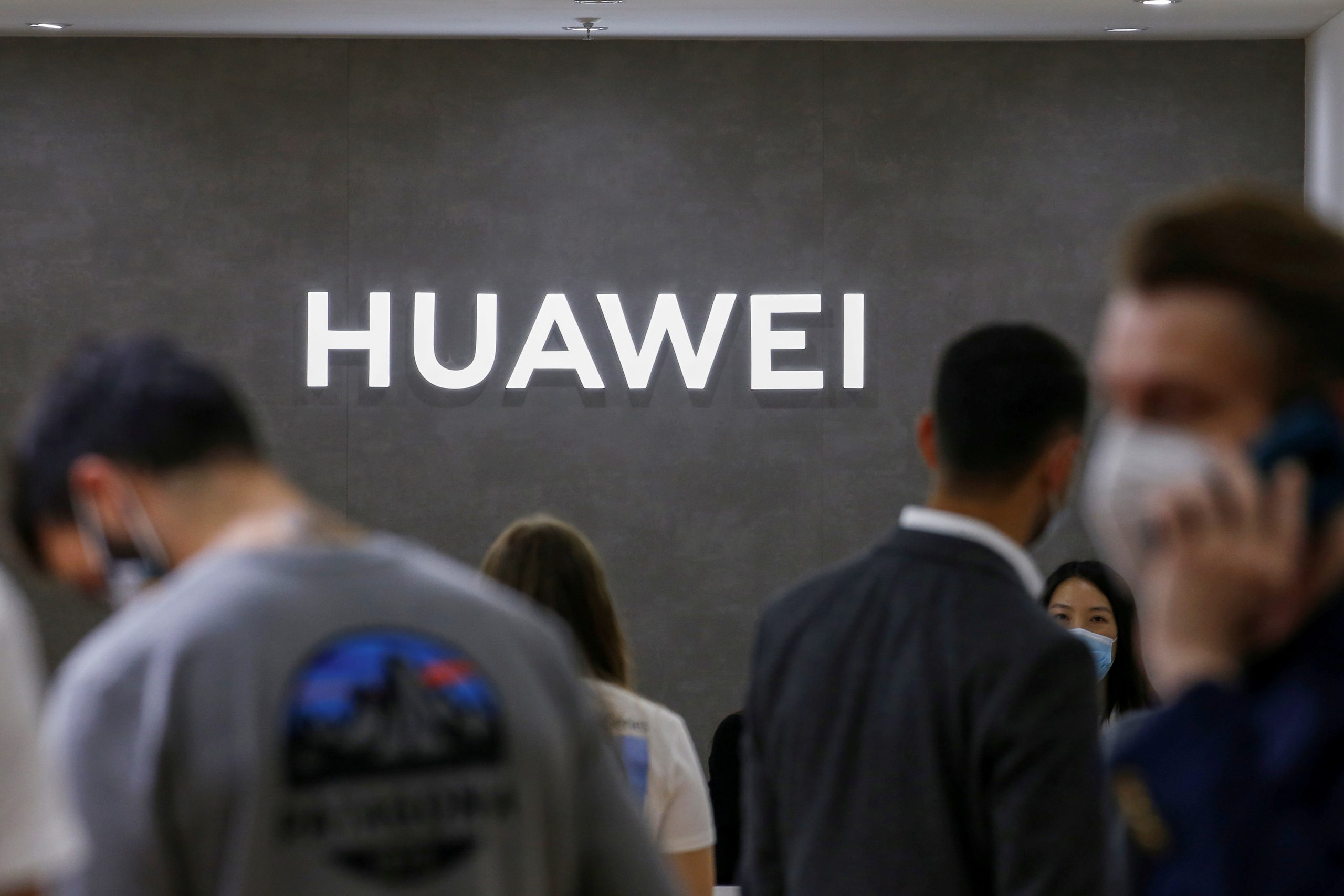 FILE PHOTO: The Huawei logo is seen at the IFA consumer technology fair, in Berlin FILE PHOTO: The Huawei logo is seen at the IFA consumer technology fair, amid the coronavirus disease (COVID-19) outbreak, in Berlin, Germany September 3, 2020.  REUTERS/Michele Tantussi/File Photo MICHELE TANTUSSI
