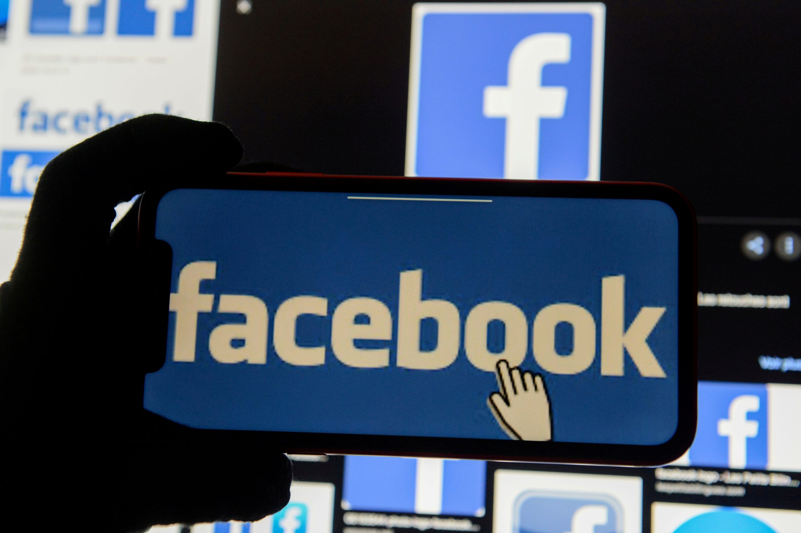 FILE PHOTO: Facebook logos FILE PHOTO: The Facebook logo is displayed on a mobile phone in this picture illustration taken December 2, 2019. REUTERS/Johanna Geron/Illustration/File Photo JOHANNA GERON