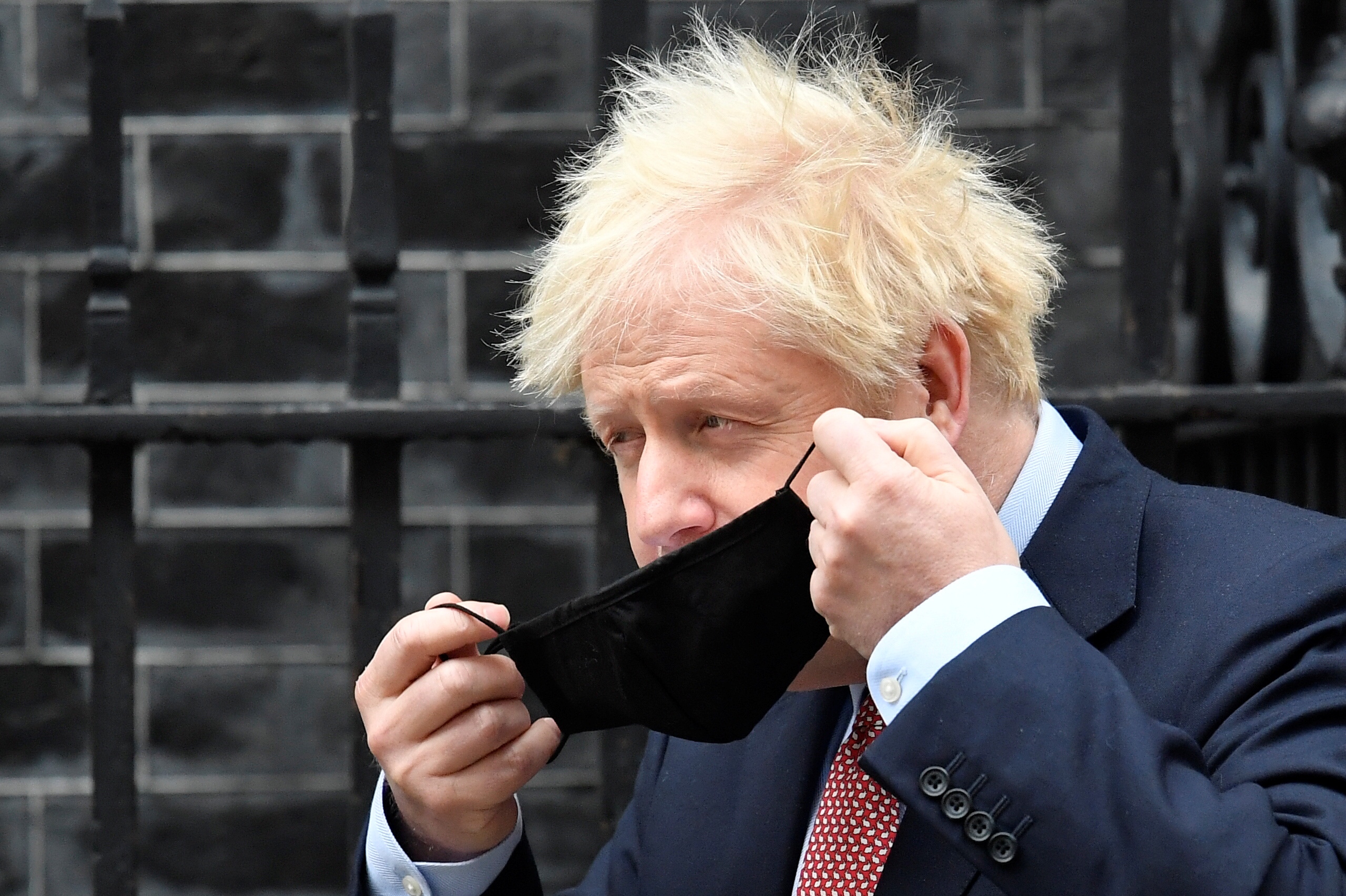 Britain’s Prime Minister Boris Johnson leaves Downing Street Britain?s Prime Minister Boris Johnson puts on a face mask as he leaves Downing Street to deliver his Conservative Party Conference virtual keynote speech, in London, Britain, October 6, 2020. REUTERS/Toby Melville TOBY MELVILLE