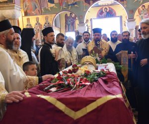 epa08789318 Orthodox priests hold a service by the coffin of Serbian Orthodox Church Metropolitan bishop of Montenegro, Metropolitan Amfilohije (Radovic) in Podgorica, Montenegro, 31 October 2020. Metropolitanate of Montenegro and the Littoral reported that Metropolitan Amfilohije died on 30 October 2020 in Podgorica, Montenegro at the age of 82. He had served in the top post in the Serbian Orthodox church for 30 years, a period in which former communist Yugoslavia shattered into separate states, including the Montenegro's breakaway from Serbia in 2006.  EPA/BORIS PEJOVIC