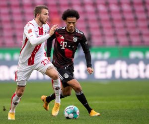 epa08788843 Jannes Horn (L) of Koeln and  Leroy Sane of Bayern in action during the German Bundesliga soccer match between 1. FC Kolen and Bayern Munich in Cologne, Germany, 31 October 2020.  EPA/Marius Becker / POOL