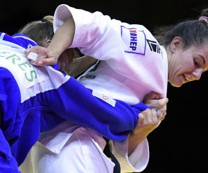epa08772429 Barbara Matic of Croatia (in white) and Margaux Pinot of France fight in the women’s 70 kg category bout at the Judo Grand Slam at Papp Laszlo Budapest Sports Arena in Budapest, Hungary, 24 October 2020 (issued 25 October 2020).  EPA/Tamas Kovacs HUNGARY OUT