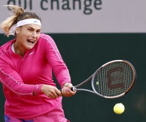 epa08717353 Aryna Sabalenka of Belarus hits a backhand during her third round match against Ons Jabeur of Tunisia during the French Open tennis tournament at Roland Garros in Paris, France, 03 October 2020.  EPA/IAN LANGSDON