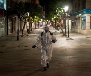 epa08777014 A local cleaner disinfects a street in the city of Ourense during the second night of curfew in Barcelona, northeastern Spain, early morning 27 October 2020. A curfew and some other measures were implemented in the region to try to contain the spreading of COVID-19 virus disease.  EPA/Brais Lorenzo