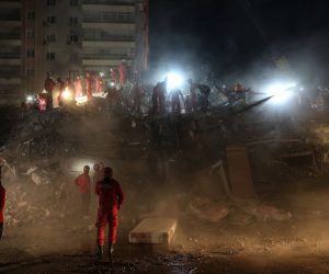 epa08791597 Rescue workers search for survivors at the site of a collapsed building after a 7.0 magnitude earthquake in the Aegean Sea, at Bayrakli district in the Aegean Sea, at Bayrakli district in Izmir, Turkey, 01 November 2020. According to Turkish media reports, at least 62 have people died while more than 800 were injured and dozens of buildings were destroyed in the earthquake.  EPA/ERDEM SAHIN