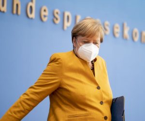 epa08793258 German Chancellor Angela Merkel arrives to a press conference after the meeting of the Corona Cabinet in Berlin, Germany, 02 November 2020. Nationwide restrictions, such as the closure of bars and restaurants for one month starting 02 November, have been announced on 28 October due to an increasing number of cases of the pandemic COVID-19 disease caused by the coronavirus SARS-CoV-2.  EPA/HENNING SCHACHT / POOL