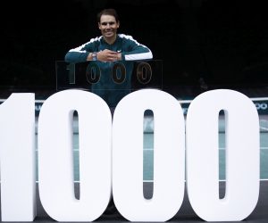 epa08799157 Rafael Nadal of Spain celebrates his victory with a trophy marking his 1,000th win on the main ATP tour following his second round match against Feliciano Lopez of Spain at the Rolex Paris Masters tennis tournament in Paris, France, 04 November 2020.  EPA/YOAN VALAT