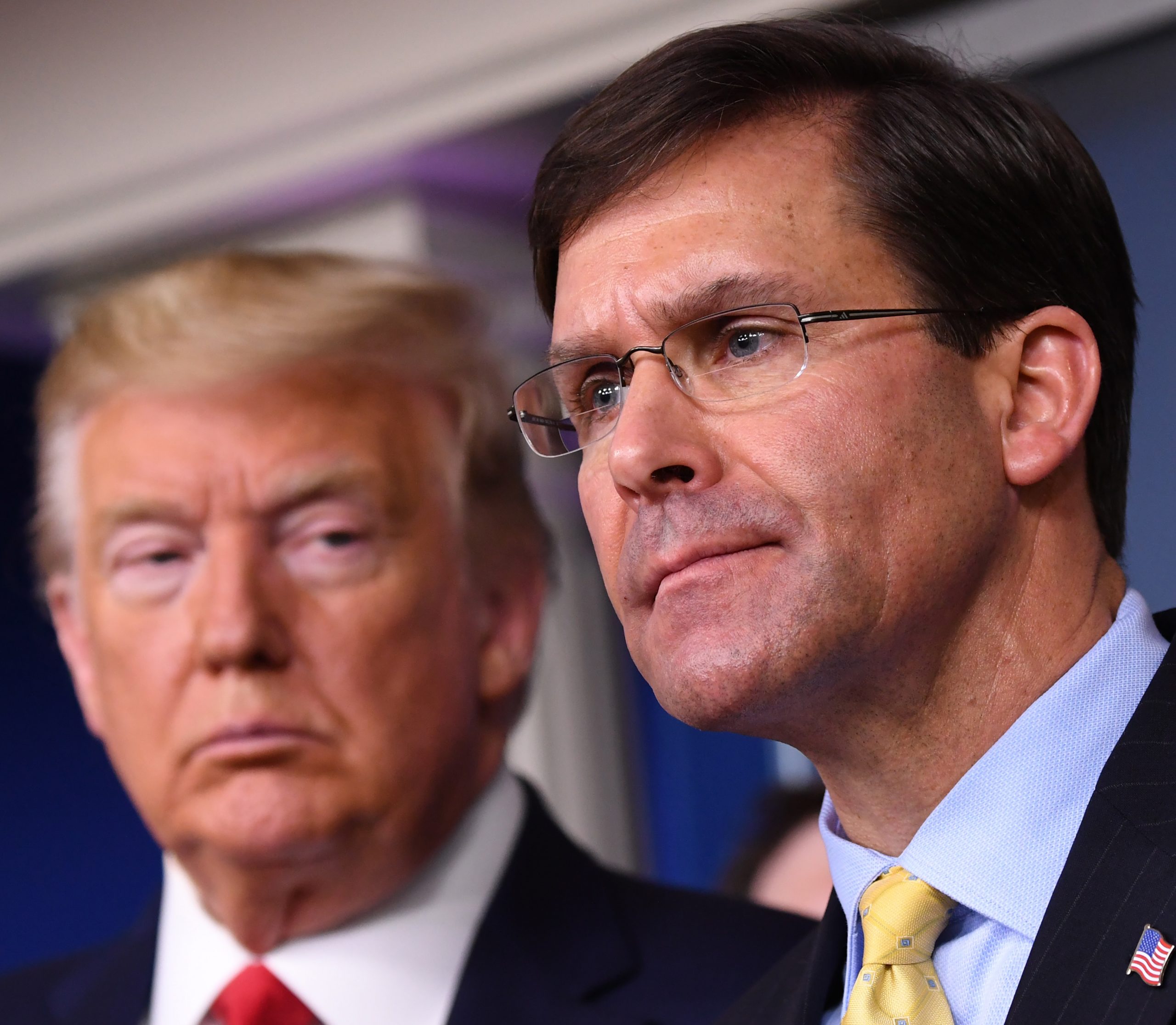 epa08810258 (FILE) - Secretary of Defense Mark Esper (R) delivers remarks on the COVID-19 (Coronavirus) pandemic as US President Donald J. Trump looks on in the Brady Press Briefing Room at the White House in Washington, DC, USA, 18 March 2020 (Reissued 09 November 2020). US President Donald Trump on 09 November 2020 said on Twitter he has fired Secretary of Defence Mark Esper while Christopher Miller was nominated by Trump as new secretary of defence.  EPA/KEVIN DIETSCH / POOL *** Local Caption *** 56128905