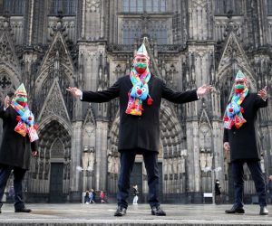 epa08813024 Members of the Cologne carnival triumvirate pose at the Cathedral in Cologne, Germany, 11 November 2020. The German carnival, the so-called fifth season, starts each year on 11 November at 11:11 am and ends on Ash Wednesday of the following year. Due to the coronavirus pandemic there will be no big events to open the carnival season.  EPA/FRIEDEMANN VOGEL