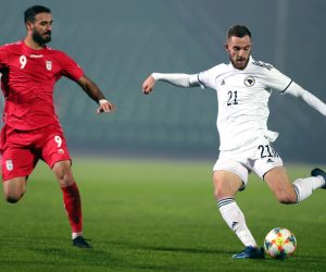 epa08816255 Stipe Loncar (R) of Bosnia and Ahmad Nourollahi (L) of Iran in action during a friendly soccer match between Bosnia and Herzegovina vs Iran in Sarajevo, Bosnia and Herzegovina, 12 November 2020.  EPA/FEHIM DEMIR