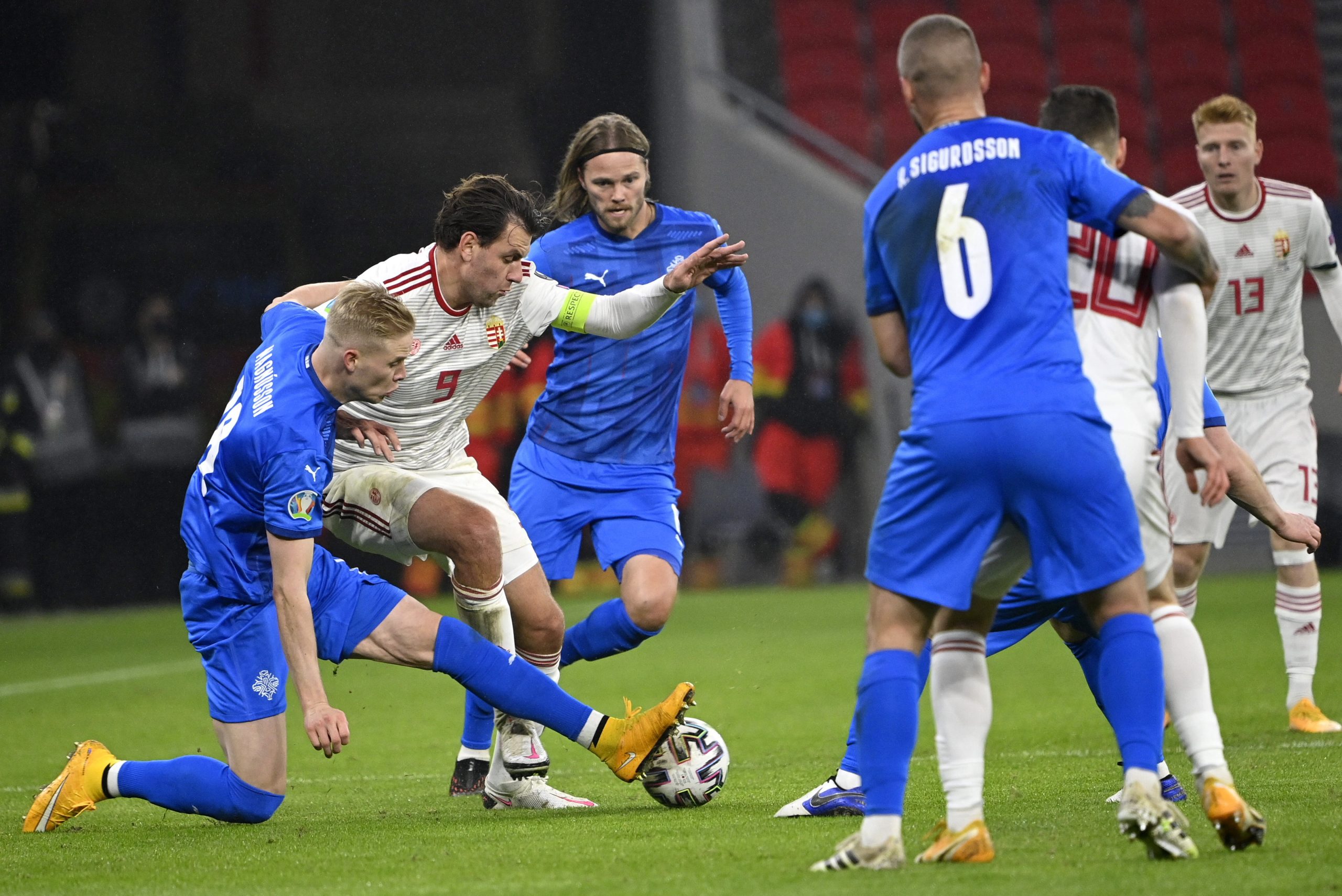 epa08816519 Hordur Magnusson (L) and Birkir Bjarnason (3RD L) of Iceland challenge Adam Szalai of Hungary for the ball during the soccer UEFA EURO 2020 qualification play-off match Hungary vs. Iceland in Puskas Arena in Budapest, Hungary, 12 November 2020.  EPA/Zsolt Szigetvary HUNGARY OUT