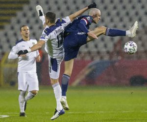 epa08816488 Scotland's Lyndon Dykes (R) in action against Serbia's Stefan Mitrovic (L) during the UEFA EURO 2020 qualification playoff match between Serbia and Scotland in Belgrade, Serbia, 12 November 2020.  EPA/ANDREJ CUKIC