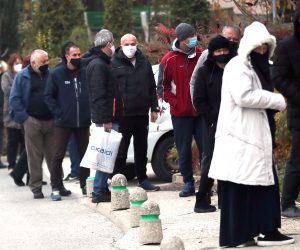 epa08821224 People wearing face masks wait in line to vote at a polling station during the local elections in Sarajevo, Bosnia and Herzegovina, 15 November 2020. More than three million Bosnian citizens are expected to vote in the country's Local elections.  EPA/FEHIM DEMIR