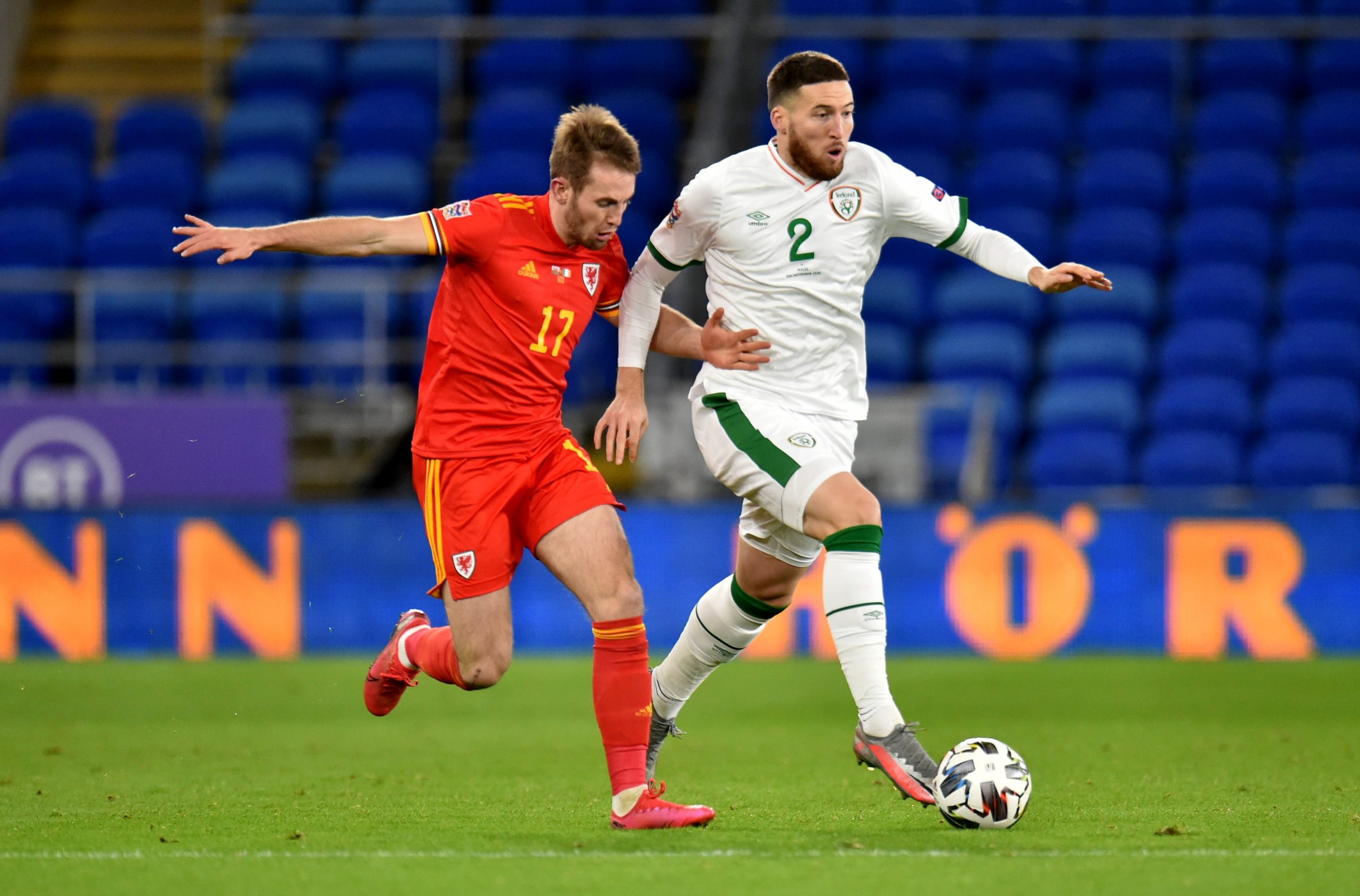 epa08822483 Rhys Norrington-Davies of Wales (L) in action against Matt Doherty of Ireland (R) during the UEFA Nations League soccer match between Wales and Ireland at the Cardiff City stadium in Cardiff, Britain, 15 November 2020.  EPA/PETER POWELL
