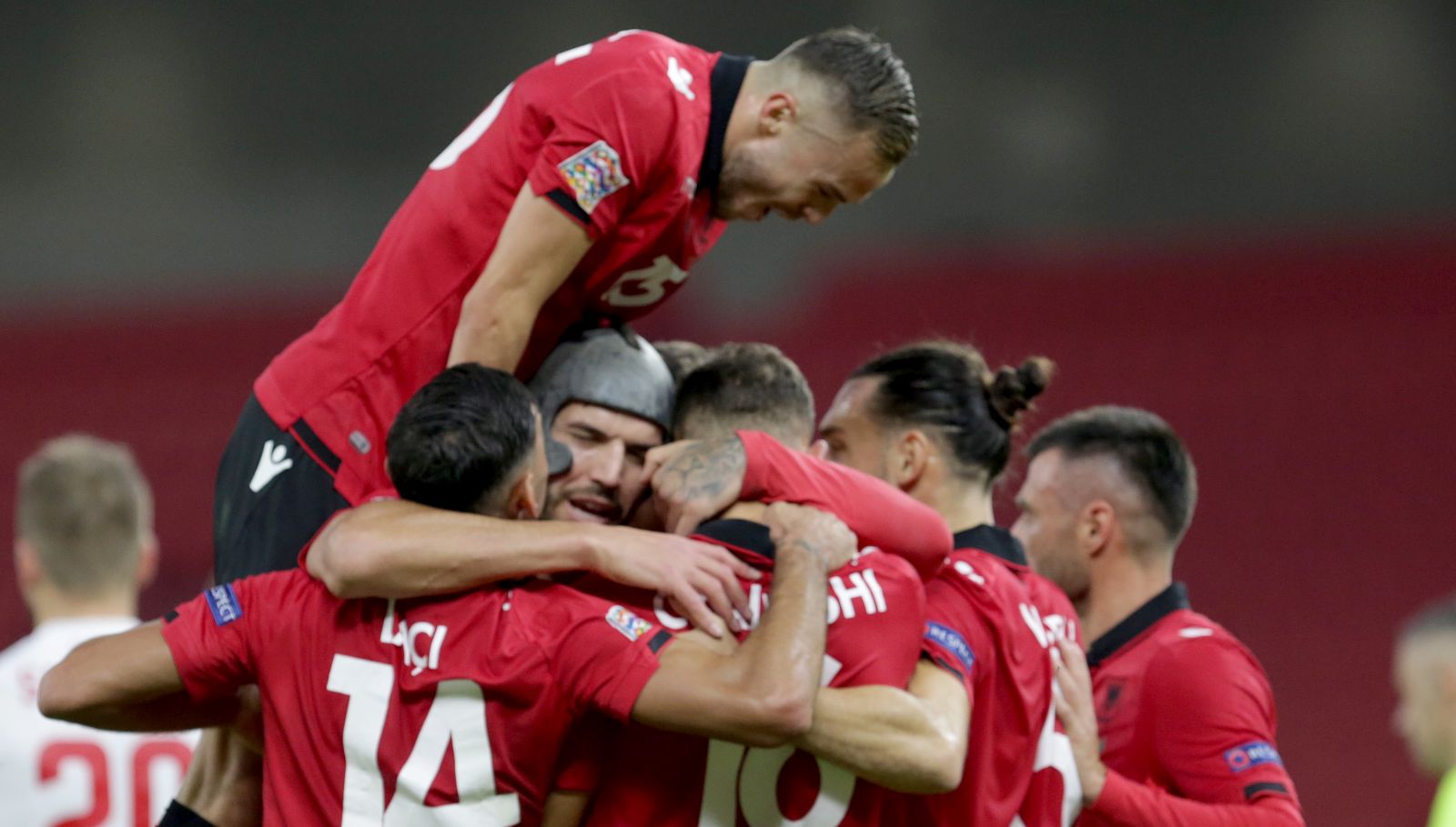 epa08827530 Albania players celebrate during the UEFA Nations League soccer match between Albania and Belarus in Tirana, Albania, 18 November 2020.  EPA/Malton Dibra