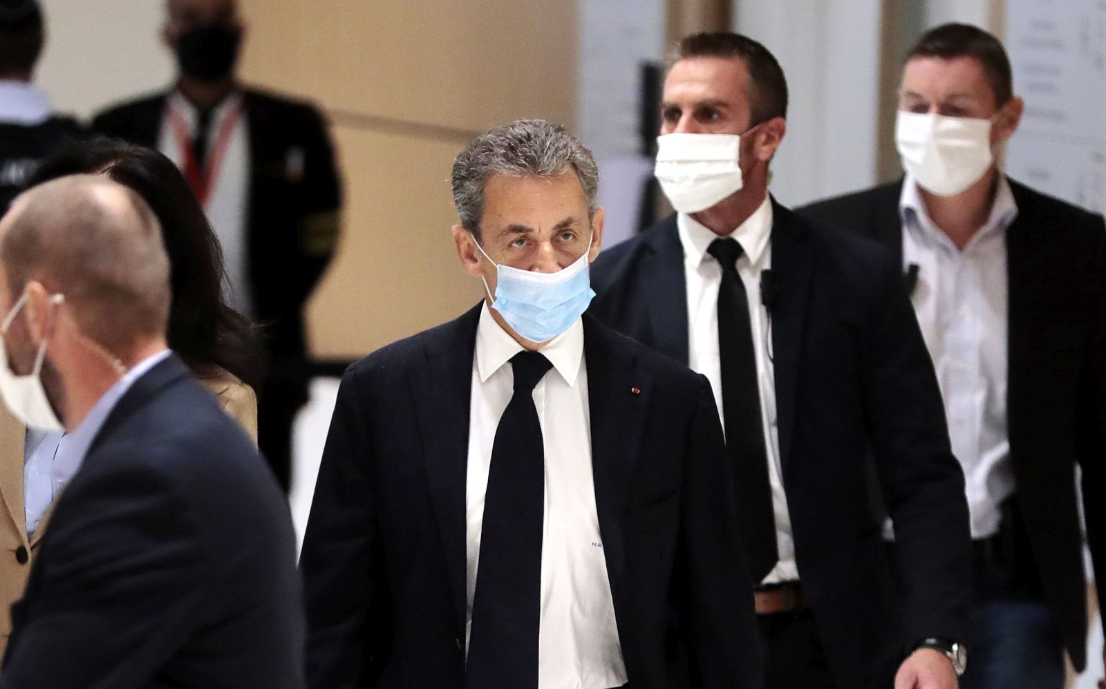 epa08837253 Former French president Nicolas Sarkozy arrives at court for his trial on corruption charges in the so-called 'wiretapping affair' in Paris, France, 23 November 2020. In 2013, Nicolas Sarkozy was using a false name, Paul Bismuth, to make phone calls to call his lawyer, Thierry Herzog, about the decision that the Court of Cassation was about to take regarding the seizure of presidential diaries in a separate case. The trial is due to run from 23 November to 10 December.
 *** Local Caption *** 55512057  EPA/JULIEN DE ROSA *** Local Caption *** 55512057
