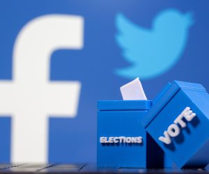 3D printed ballot boxes are seen in front of Facebook and Twitter logos 3D printed ballot boxes are seen in front of displayed Facebook and Twitter logos in this illustration taken November 4, 2020. REUTERS/Dado Ruvic/Illustration DADO RUVIC