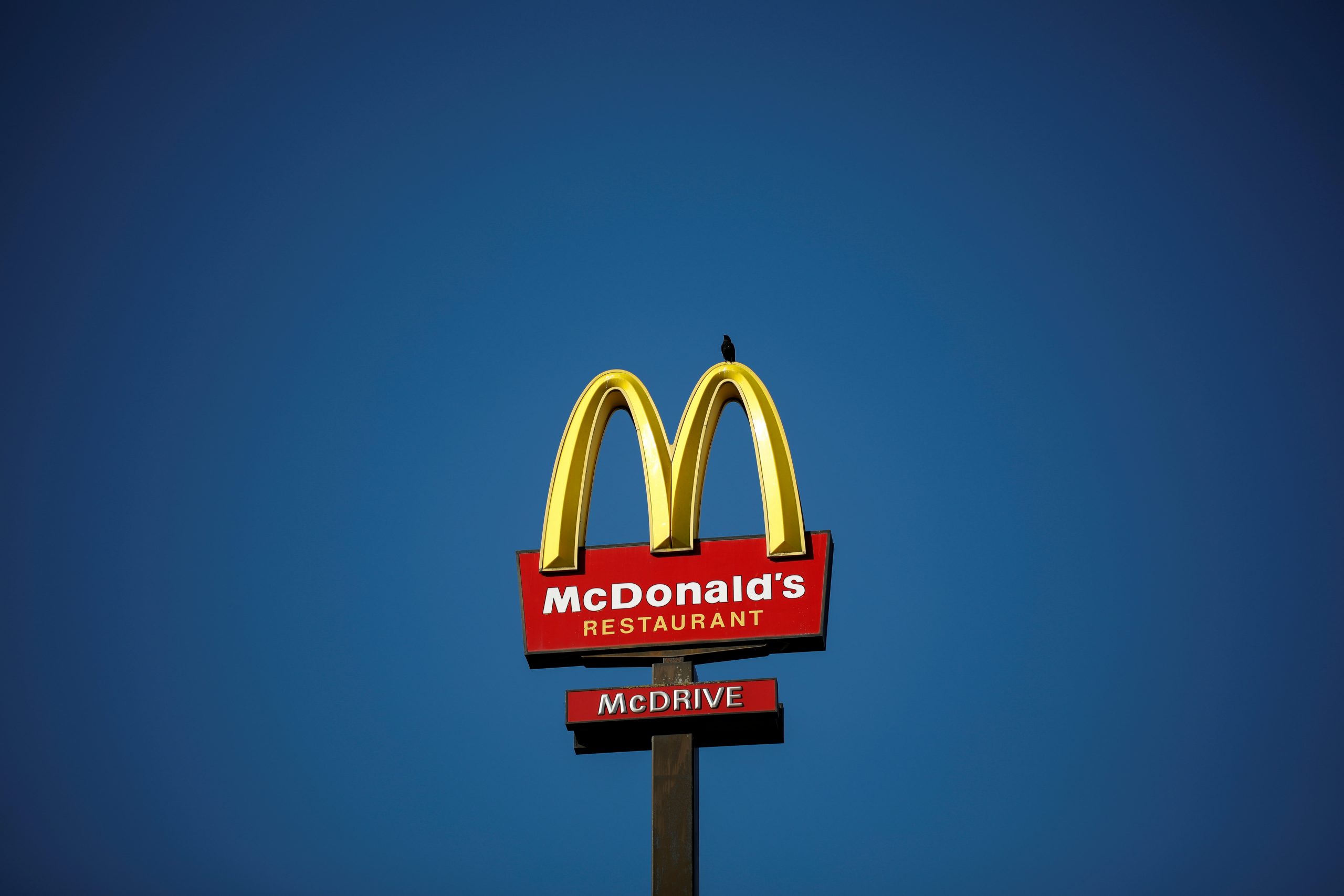 FILE PHOTO: The McDonald's company logo stands on a sign outside a restaurant in Bretigny-sur-Orge, near Paris FILE PHOTO: The McDonald's company logo stands on a sign outside a restaurant in Bretigny-sur-Orge, near Paris, France, July 30, 2020. REUTERS/Benoit Tessier/File Photo  GLOBAL BUSINESS WEEK AHEAD Benoit Tessier