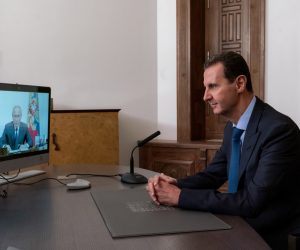 epa08809512 A handout photo made available by the Syrian Presidency shows Syrian President Bashar Assad during a video meeting with his Russian Counterpart Vladimir Putin, in Damascus, Syria, 09 November 2020.  on 9 November 2020. Assad said the upcoming Conference on Refugees Return scheduled to be held in Damascus will be the beginning of solving this humanitarian issue.  EPA/Syrian Presidency HANDOUT  HANDOUT EDITORIAL USE ONLY/NO SALES