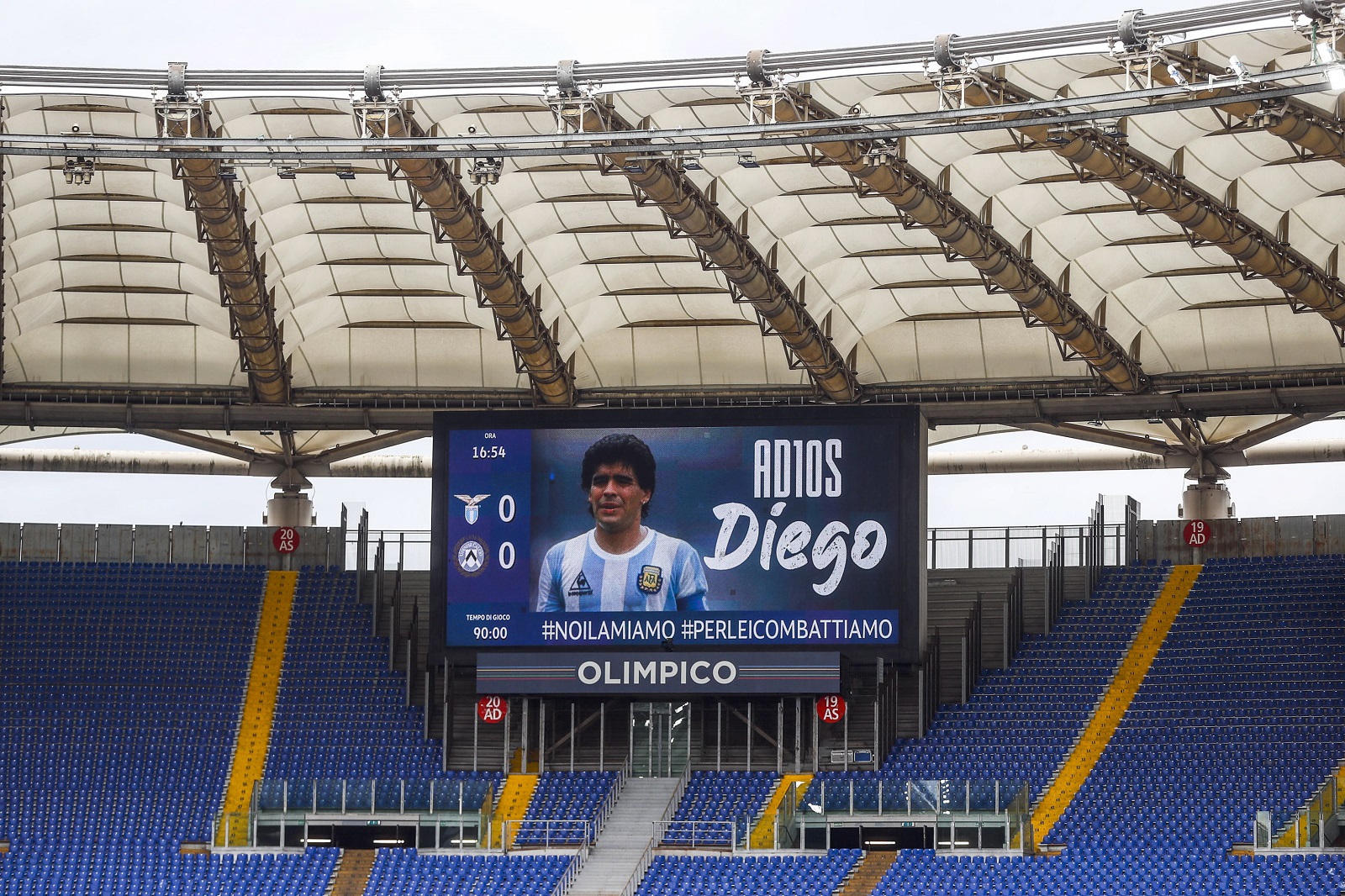 epa08850221 Late Argentinian soccer legend Diego Armando Maradona is displayed on a huge screen prior to the Italian Serie A soccer match SS Lazio vs Udinese Calcio at Olimpico stadium in Rome, Italy, 29 November 2020.  EPA/ANGELO CARCONI