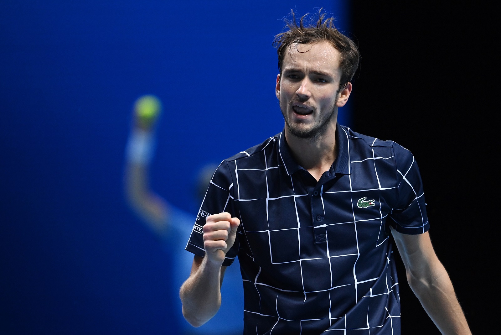 epa08828286 Russia's Daniil Medvedev reacts after winning a crucial point against Serbia's Novak Djokovic during a Nitto ATP finals tennis match at the O2 Arena in London, Britain, 18 November 2020.  EPA/ANDY RAIN