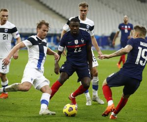 epa08814540 France's Lucas Digne (R), Marcus Thuram (C) and Finland's Rasmus Schueller  (L) in action during the friendly soccer match between France and Finland in Paris, France, 11 November 2020.  EPA/YOAN VALAT