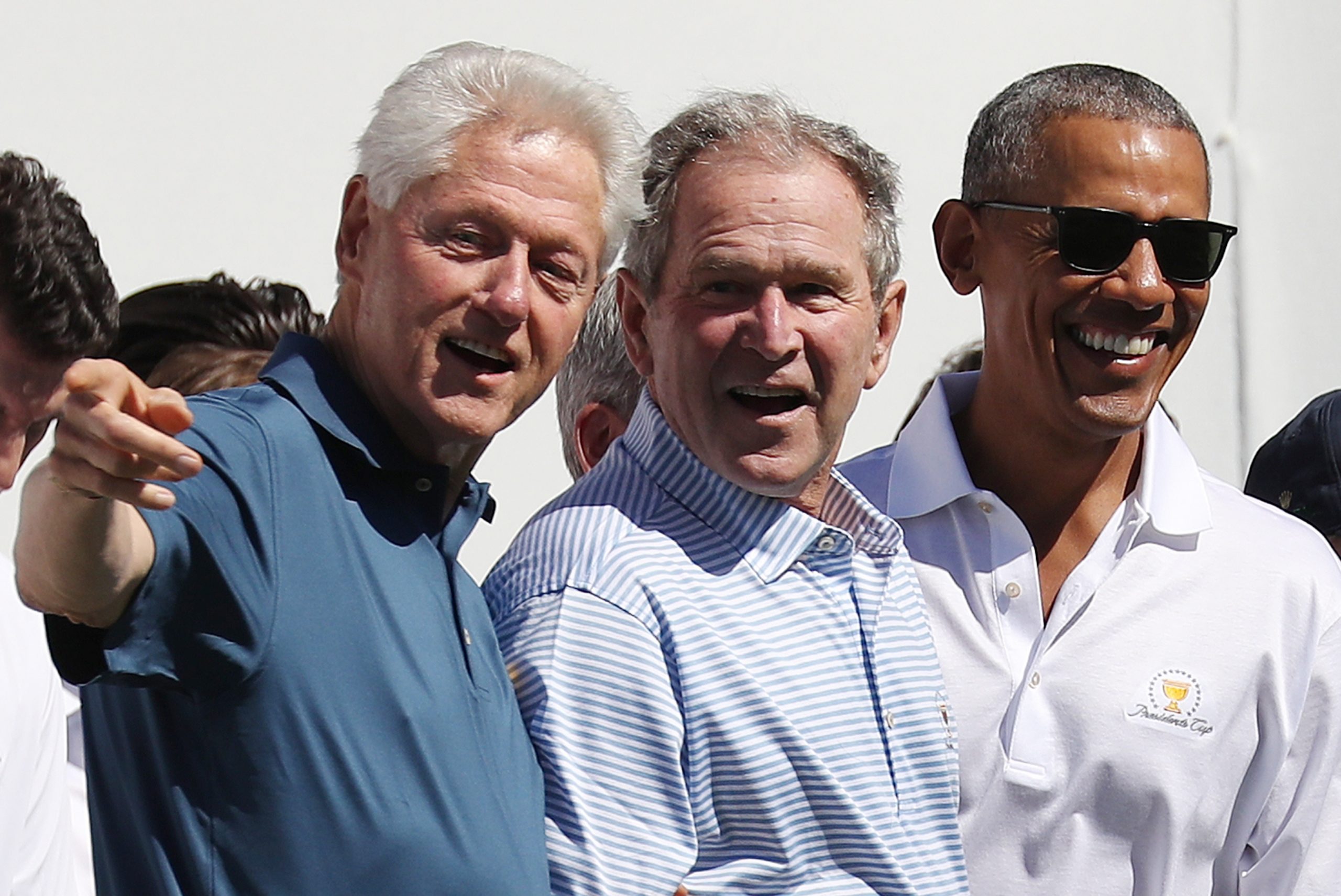 epa08859435 (FILE) - Former US Presidents Bill Clinton (L), George W. Bush (C) and Barack Obama during opening ceremonies for the 2017 Presidents Cup at Liberty National Golf Club in Jersey City, New Jersey, USA, 28 September 2017 (reissued 03 December 2020). According to media reports, the three former presidents will volunteer to get a Covid-19 vaccination publicly in order to promote the safety of the upcoming coronavirus vaccine.  EPA/ANDREW GOMBERT *** Local Caption *** 53796188