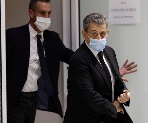 epa08868691 Former French president Nicolas Sarkozy exits the courtroom during his trial on corruption charges in the so-called 'wiretapping affair' in Paris, France, 07 December 2020. In 2013, Nicolas Sarkozy was using a false name, Paul Bismuth, to make phone calls to call his lawyer, Thierry Herzog, about the decision that the Court of Cassation was about to take regarding the seizure of presidential diaries in a separate case. The trial is due to run from 23 November to 10 December.  EPA/IAN LANGSDON