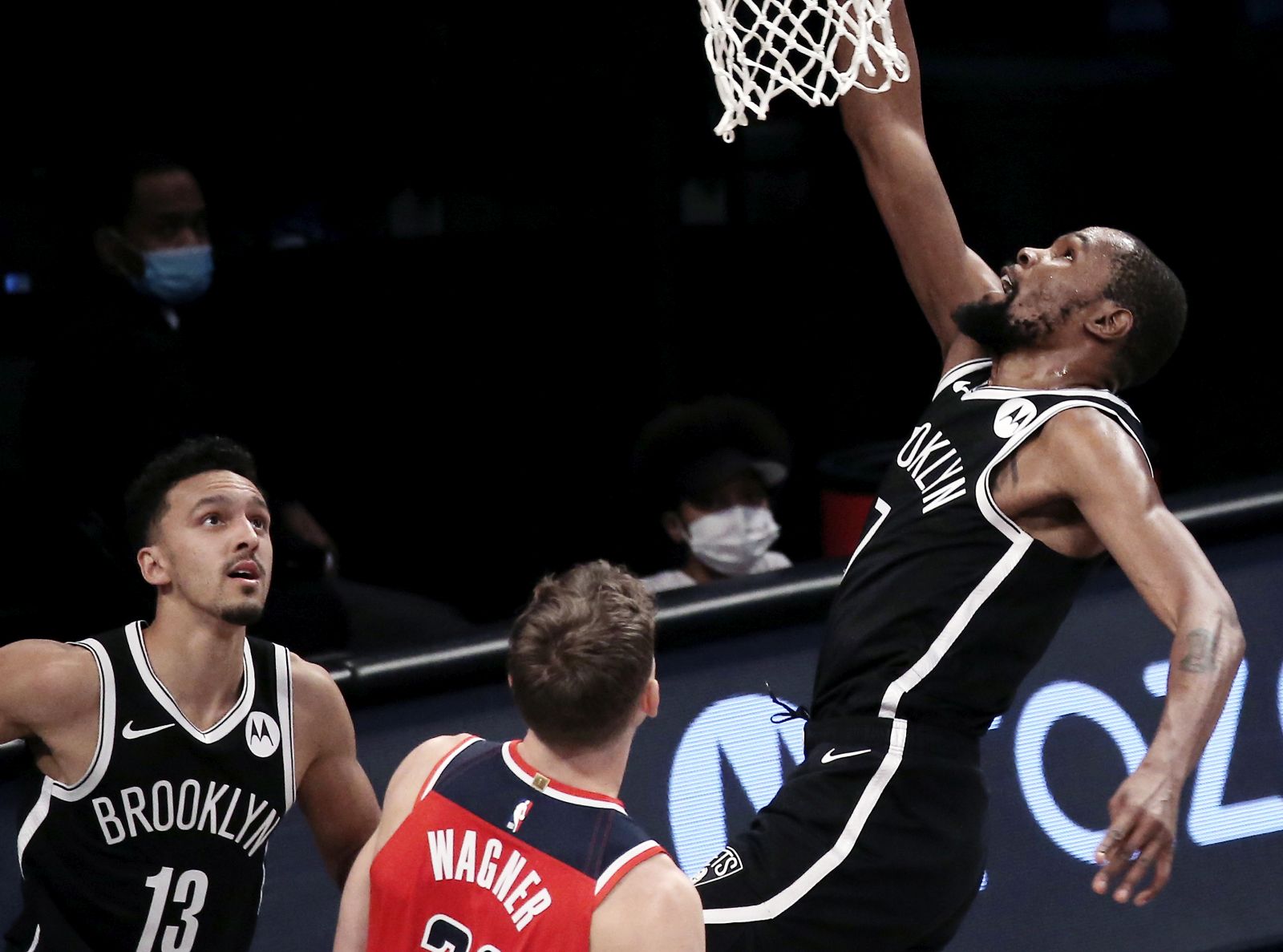 epa08882931 Brooklyn Nets forward Kevin Durant (R) shoots and scores during the first half of a  preseason game between the Washington Wizards and the Brooklyn Nets at Barclays Center in Brooklyn, New York, USA, 13 December 2020.  EPA/Peter Foley  SHUTTERSTOCK OUT