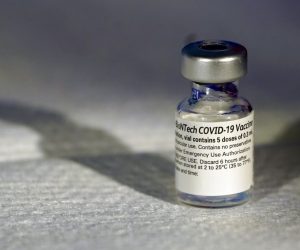 epa08884262 A vial of Pfizer’s COVID-19 vaccine that receive emergency use authorization is seen at George Washington University Hospital, in Washington, DC, USA, 14 December 2020. Adams spoke before watching COVID-19 vaccines being administered.  EPA/Jacquelyn Martin / POOL