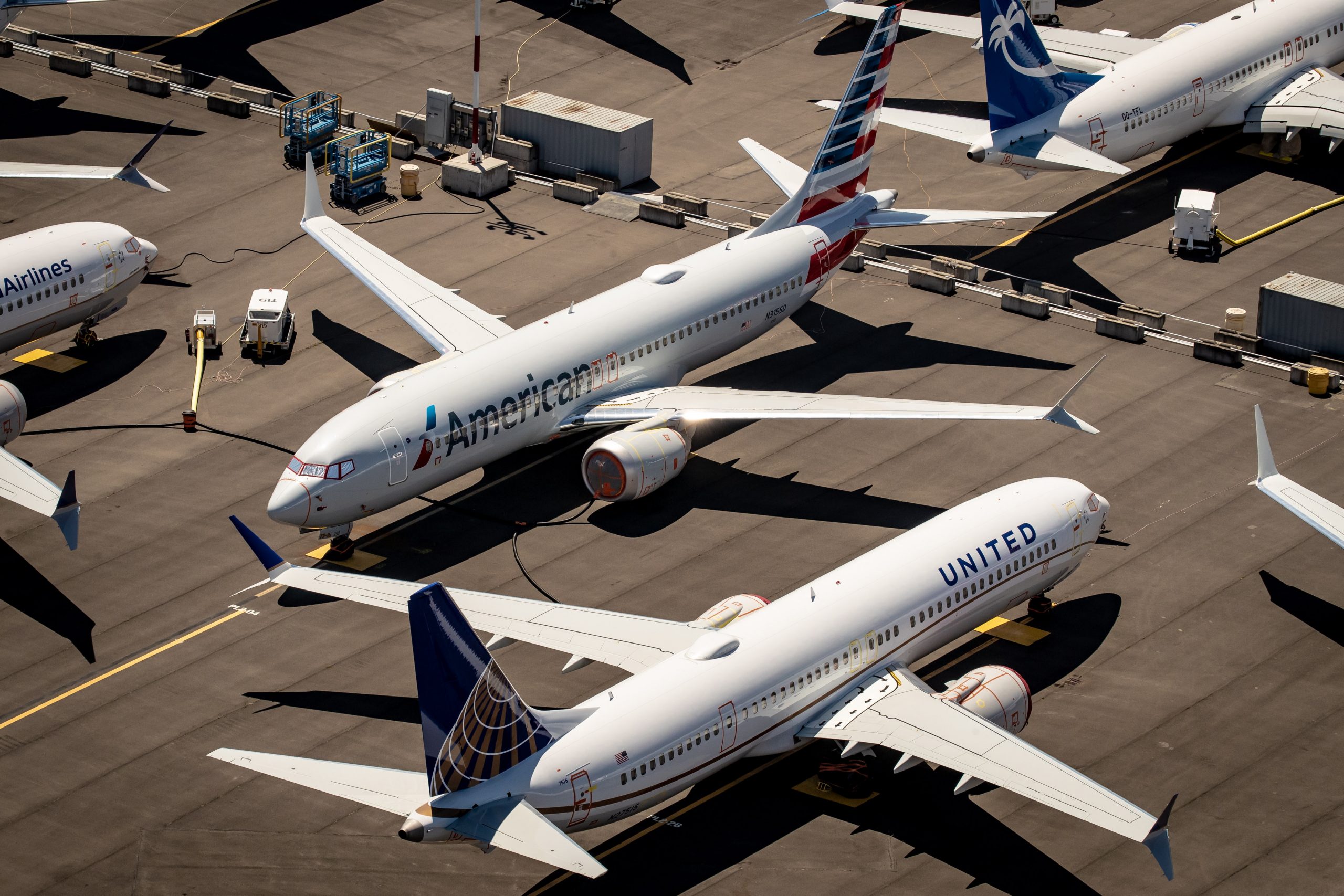 epa08892946 (FILE) - An aerial view of Boeing 737 Max 8 aircraft owned by American Airlines and United Airlines parked at Boeing Field in Seattle, Washington, USA, 21 July 2019 (reissued 19 December 2020). According to US Senate investigators Boeing officials inappropriately coached test pilots during the 737 Max aircraft recertification process.  EPA/GARY HE   EDITORIAL USE ONLY *** Local Caption *** 55830723