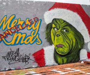 epa08899272 A mural reading 'Merry Xmas cancelled' is on display at the Mauerpark, a former part of the Berlin Wall, in Berlin, Germany, 22 December 2020. As the number of cases of the COVID-19 disease caused by the SARS-CoV-2 coronavirus is still rising throughout Germany, the government has imposed a second hard lockdown with businesses closing from 16 December on until 10 January 2021.  EPA/HAYOUNG JEON