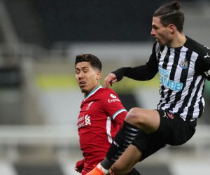 epa08911843 Newcastle's Fabian Schar (R) in action against Liverpool's Roberto Firmino (L) during the English Premier League soccer match between Newcastle United and Liverpool in Newcastle, Britain, 30 December 2020.  EPA/Scott Heppell / POOL EDITORIAL USE ONLY. No use with unauthorized audio, video, data, fixture lists, club/league logos or 'live' services. Online in-match use limited to 120 images, no video emulation. No use in betting, games or single club/league/player publications.