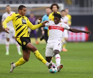epa08879228 Tanguy Coulibaly (R) of VfB Stuttgart is challenged by Manuel Akanji of Borussia Dortmund during the German Bundesliga soccer match between Borussia Dortmund and VfB Stuttgart at Signal Iduna Park in Dortmund, Germany, 12 December 2020.  EPA/LARS BARON / POOL DFL regulations prohibit any use of photographs as image sequences and/or quasi-video.