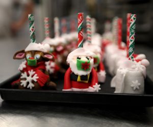 epa08889695 Biscuits of Santa Claus (C) and Rudolph the Red-Nosed Reindeer (L) wearing face masks are seen at the bakery Schuerener Backparadies in Dortmund, Germany, 17 December 2020. As the number of cases of the COVID-19 disease caused by the SARS-CoV-2 coronavirus is still rising throughout Germany, the government has imposed a second hard lockdown with businesses closing from 16 December on until 10 January 2021.  EPA/FRIEDEMANN VOGEL
