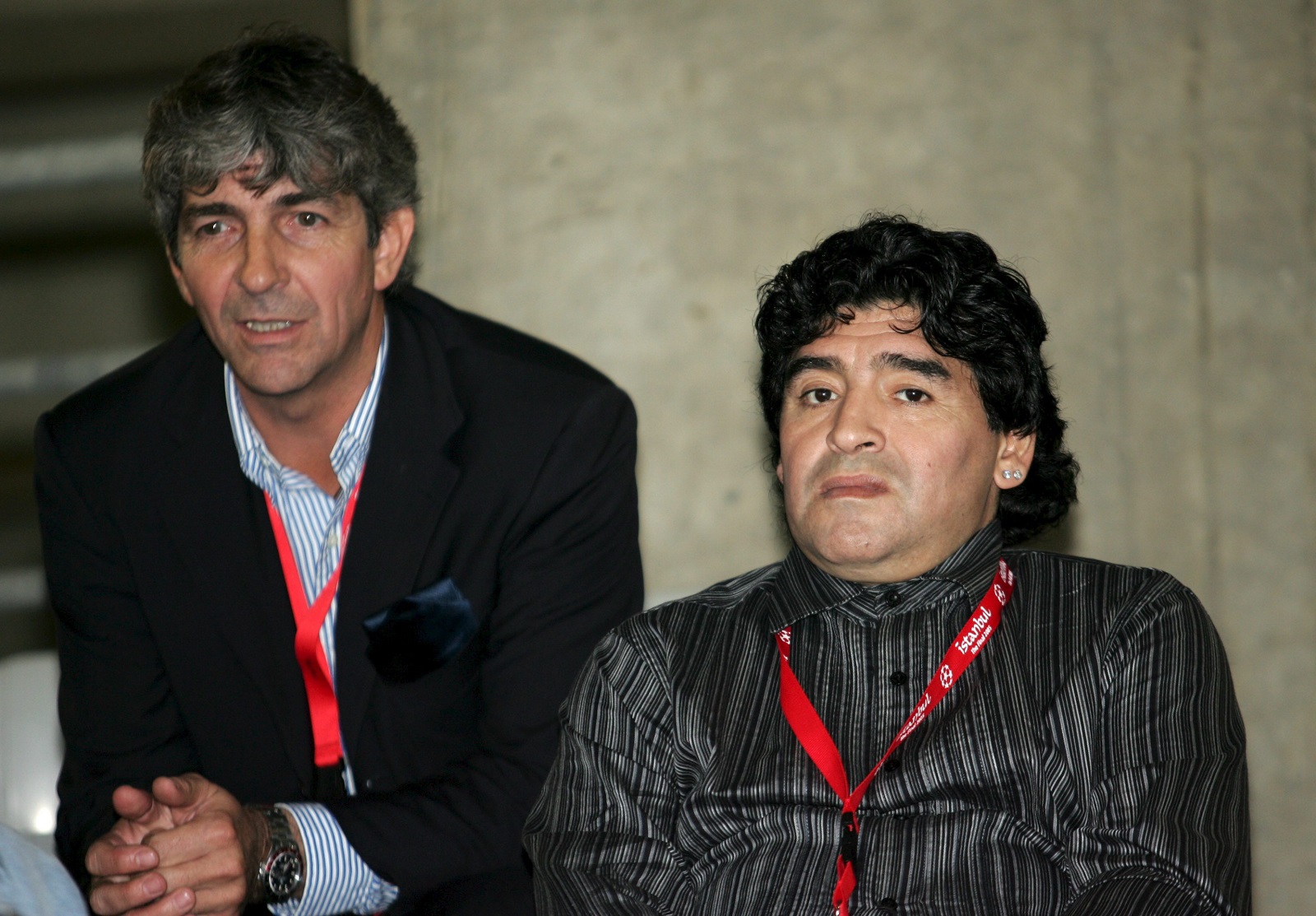 epa08873619 (FILE) - Former Argentinian soccer star Diego Maradona (R) and former Italian striker Paolo Rossi (L) watch a training session of AC Milan at Ataturk Olympic Stadium in Istanbul, Tuesday 24 May 2005 (reissued 10 December 2020). According to news reports, Paolo Rossi died aged 64 on 09 December 2020. As part of FIFA's 100th anniversary, in 2004 Rossi was named as one of the Top 125 greatest living footballers.  EPA/DANIEL DAL ZENNARO