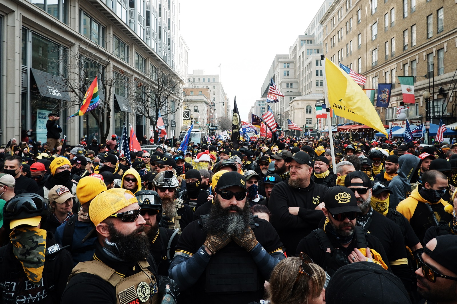 epa08880120 Members of the far-right group the Proud Boys gather in E street northwest before marching into Freedom Plaza, in Washington, DC, USA, 12 December 2020. Supporters of US President Donald J. Trump are gathering in Washington DC as part of the 'Million MAGA March' to support the President's baseless claims of voter fraud in the 2020 election.  EPA/GAMAL DIAB