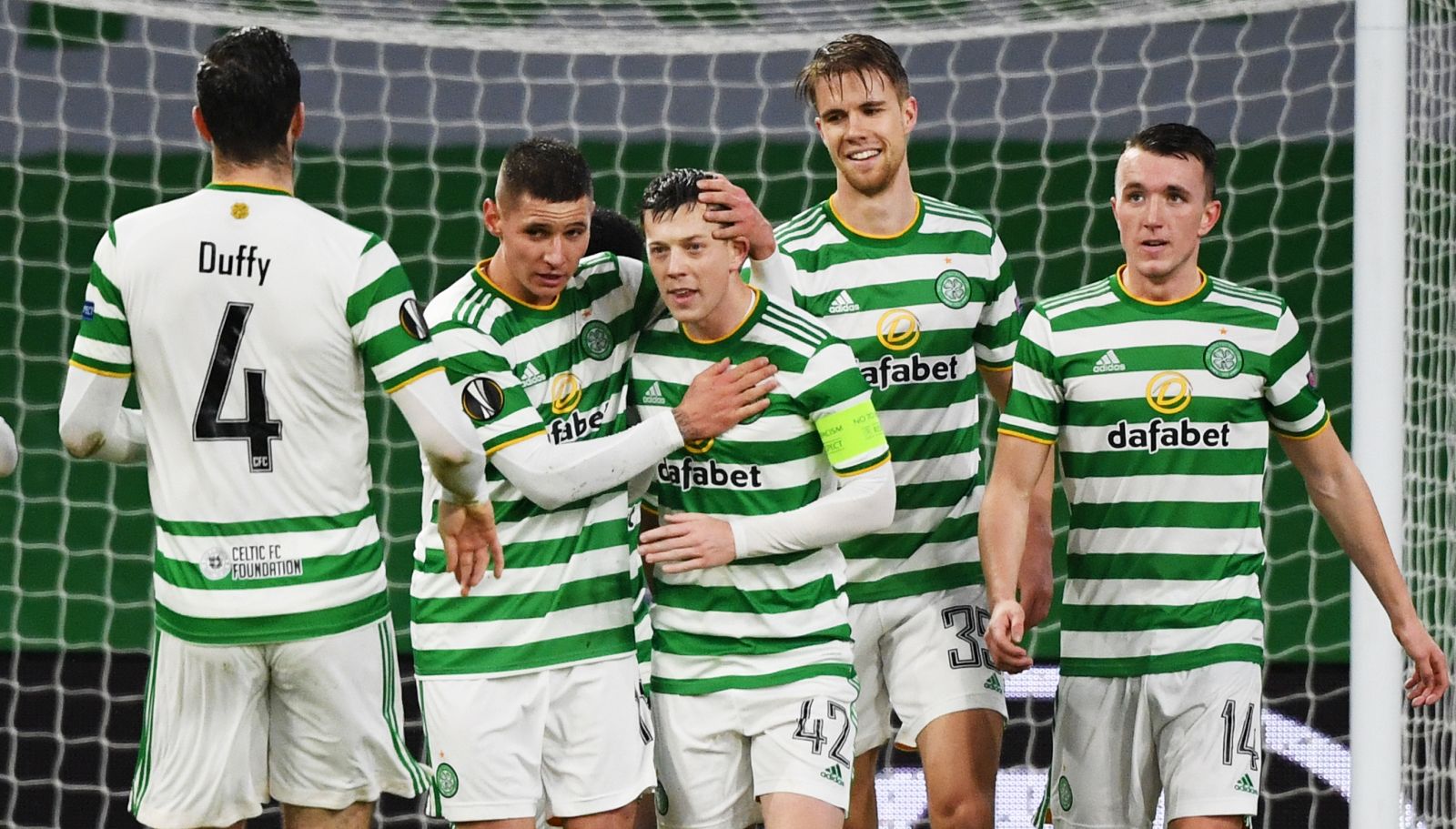 epa08876046 Celtic captain Callum McGregor (C) is celebrated by teammates after scoring with a penalty during the UEFA Europa League group H soccer match between Celtic Glasgow vs OSC Lille in Glasgow, Britain, 10 December 2020.  EPA/Andy Buchanan / POOL