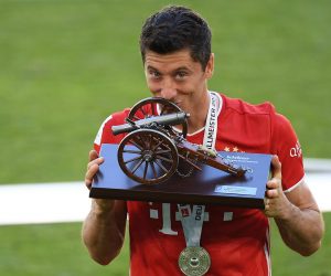 epa08890524 (FILE) - Robert Lewandowski of Bayern Munich poses with the trophy for the top goalscorer of the season after the German Bundesliga soccer match between VfL Wolfsburg and Bayern Munich in Wolfsburg, Germany, 27 June 2020 (re-issued on 17 December 2020). Polish striker Robert Lewandowski has been named The Best FIFA Men's Player during the virtual Best FIFA Football Awards 2020 on 17 December 2020.  EPA/STUART FRANKLIN / POOL CONDITIONS - ATTENTION: The DFL regulations prohibit any use of photographs as image sequences and/or quasi-video. *** Local Caption *** 56180702