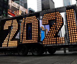 epa08898272 The 2021 light bulb sign tested and displayed for the media before it will be illuminated as part of '2021 New Year's Eve celebration in Times Square in New York, New York, USA, 21 December 2020. Due to Covid-19 restrictions the public will not attend in person in Times Square, the event will be virtual.  EPA/Peter Foley