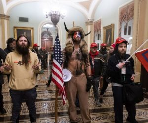 epa08923457 Supporters of US President Donald J. Trump stand by the door to the Senate chambers after they breached the US Capitol security in Washington, DC, USA, 06 January 2021. Protesters stormed the US Capitol where the Electoral College vote certification for President-elect Joe Biden took place.  EPA/JIM LO SCALZO