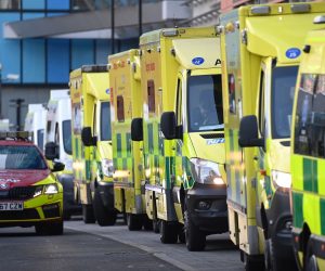 epa08924893 Ambulances line up outside the Royal London Hospital, in London, Britain, 07 January 2021. Britain's National Health Service (NHS) is coming under severe pressure as COVID-19 hospital admissions continue to rise across the United Kingdom. Some 1,000 people are dying each day from the disease.  EPA/ANDY RAIN