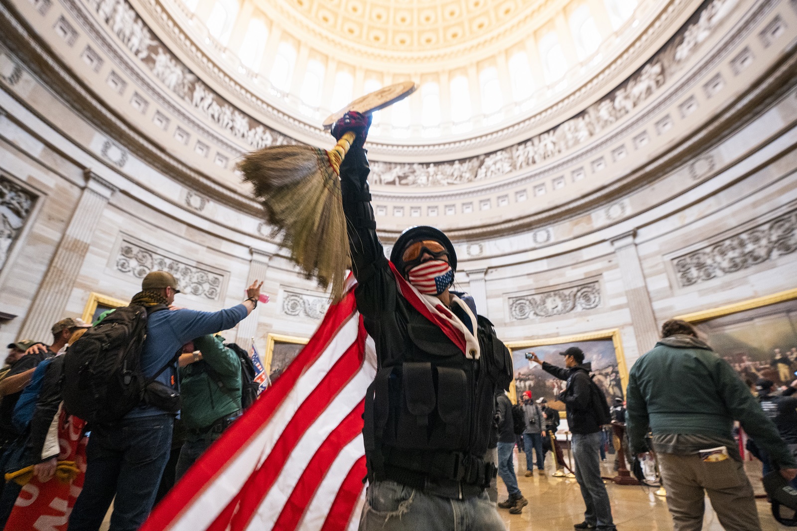 epa08926300 Supporters of US President Donald J. Trump and his baseless claims of voter fraud run through the Rotunda of the US Capitol after breaching Capitol security during their protest against Congress certifying Joe Biden as the next president in Washington, DC, USA, 06 January, 2020 (issued 08 January 2020). On 08 January Assistant House Speaker Katherine Clarke said the House will move to impeach President Trump if the Vice President and Cabinet do not remove him on their own.  EPA/JIM LO SCALZO
