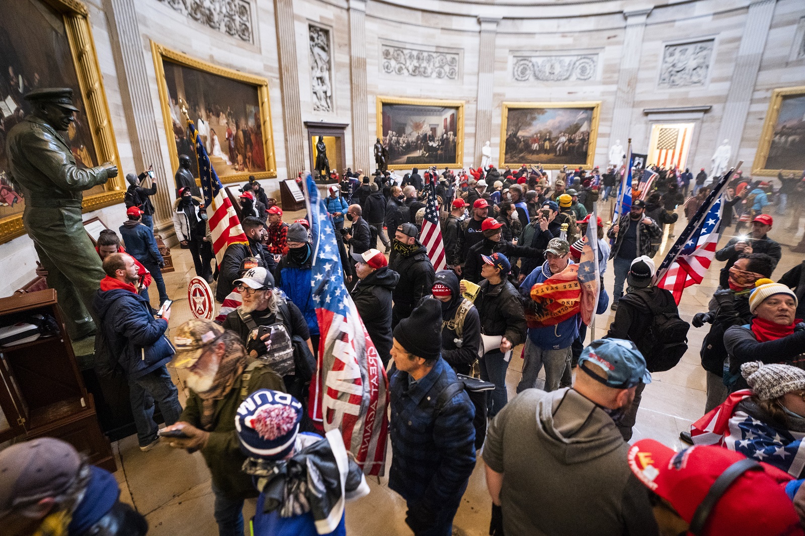 epa08926301 Supporters of US President Donald J. Trump and his baseless claims of voter fraud run through the Rotunda of the US Capitol after breaching Capitol security during their protest against Congress certifying Joe Biden as the next president in Washington, DC, USA, 06 January, 2020 (issued 08 January 2020). On 08 January Assistant House Speaker Katherine Clarke said the House will move to impeach President Trump if the Vice President and Cabinet do not remove him on their own.  EPA/JIM LO SCALZO