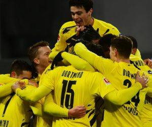epa08929118 Dortmund's players celebrate the 2-0 lead during the German Bundesliga soccer match between RB Leipzig and Borussia Dortmund in Leipzig, Germany, 09 January 2021.  EPA/CLEMENS BILAN CONDITIONS - ATTENTION: The DFL regulations prohibit any use of photographs as image sequences and/or quasi-video.